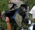 Zborul MH17: Inregistrare video, atribuita separatistilor, in care acestia scotocesc printre obiectele victimelor