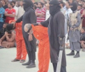 Jihadistii au publicat un nou video in care executa doi barbati acuzati de magie neagra. Imaginile va pot afecta emotional