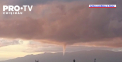 Fenomen spectaculos in Genova. Locuitorii au avut parte de un dublu fenomen natural, un apus de soare spectaculos, completat de o tromba marina - VIDEO