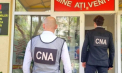 Percheziții în raionul Strășeni: Un bărbat - cercetat de CNA, după ce ar fi cerut 3000 de euro pentru a ajuta o persoană să-și perfecteze permisul de conducere