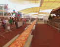 Este cea mai mare pizza din lume! 80 de bucatari italieni au stabilit un nou record mondial: o pizza de 1.600 de metri. Vezi cum arata - VIDEO