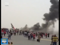 Un pompier si-a pierdut viata incercand sa stinga flacarile care au cuprins ieri un avion pe aeroportul din Dubai. Zece persoane au fost spitalizate - VIDEO
