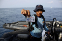 Au fost recuperate primele trupuri de la locul prabusirii avionului indonezian - FOTO