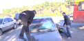 Actiune cu batai si parbriz spart. Momentul in care un activist distruge geamurile unui BMW. VIDEO