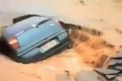 VIDEO. "Doamne! Nu se poate asa ceva!" O masina dispare intr-o gaura din asfalt in cateva secunde
