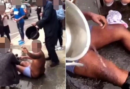 Atac cu acid dupa o cursa in trafic. Momentul in care trecatorii arunca apa pe victime Atac cu acid dupa o cursa in trafic. Momentul in care trecatorii arunca apa pe victime