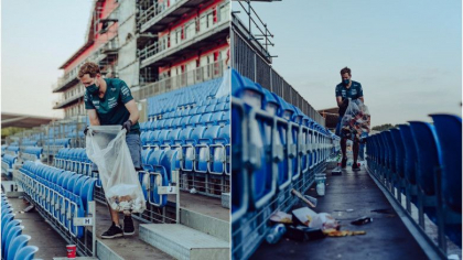 Gestul pilotului Sebastian Vettel, care a sensibilizat fanii Formulei 1. A strans gunoiul din tribuna dupa terminarea cursei - FOTO