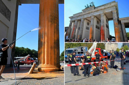 Activistii de mediu au vopsit cu spray portocaliu simbolul capitalei Germaniei Activistii de mediu au vopsit cu spray portocaliu simbolul capitalei Germaniei