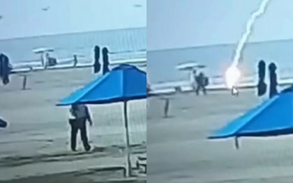 Momentul in care o femeie este lovita de fulger in timp ce se plimba pe o plaja. Imagini cu impact emotional - VIDEO