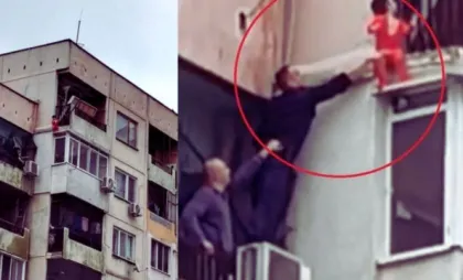 Băiețel de 3 ani care stătea pe exteriorul unui balcon Băiețel de 3 ani care stătea pe exteriorul unui balcon