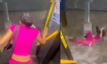 Momentul în care o femeie este luată de viitură în New York Momentul în care o femeie este luată de viitură în New York