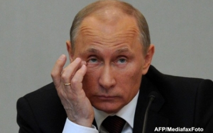 Vladimir Putin afirma ca mama sa l-a botezat in secret fata de tatal sau - presa