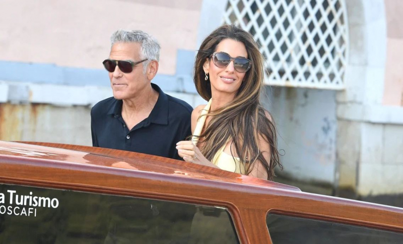 Amal a strălucit la Veneția, la brațul soțului ei George Clooney. Cum au fost surprinși înaintea Festivalului de Film
 