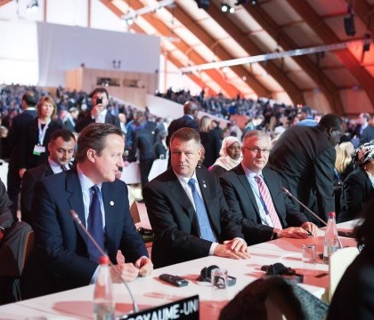 Klaus Iohannis a discutat cu premierul britanic, la Paris, despre schimbarile climatice. Ce a solicitat presedintele
