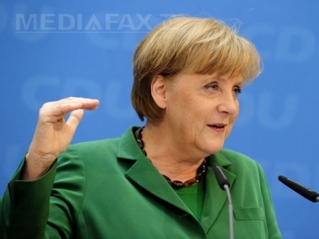 E sau nu Angela Merkel in fotografie? Imaginea cu cancelarul german face valva pe internet